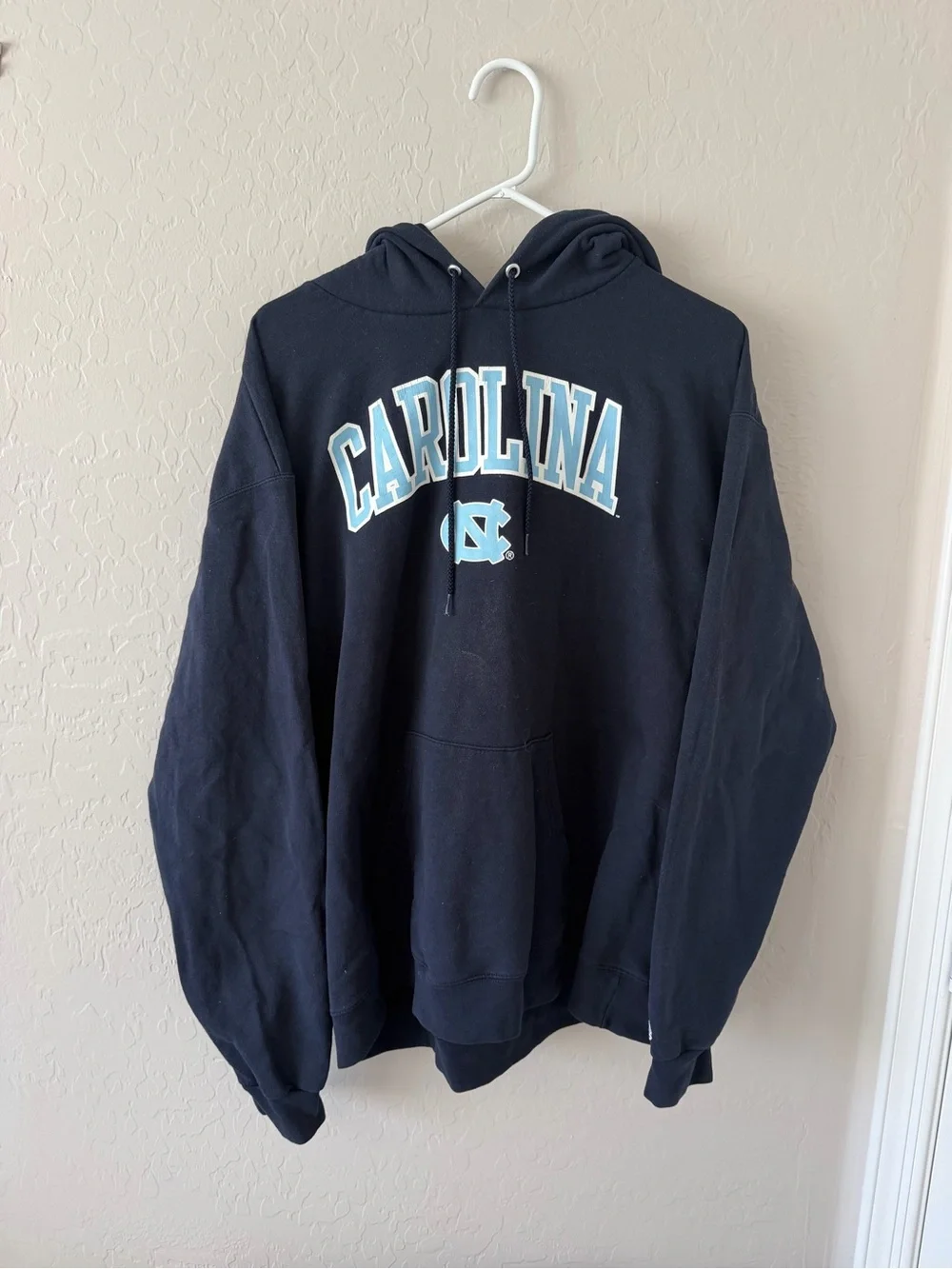Champion Navy Hoodie with Carolina Arch and Light Blue Logo